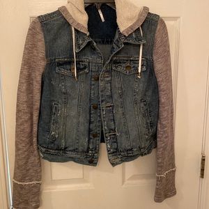 Jean jacket with sweatshirt style sleeves. Size small.
